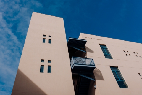 A building with a blue balcony